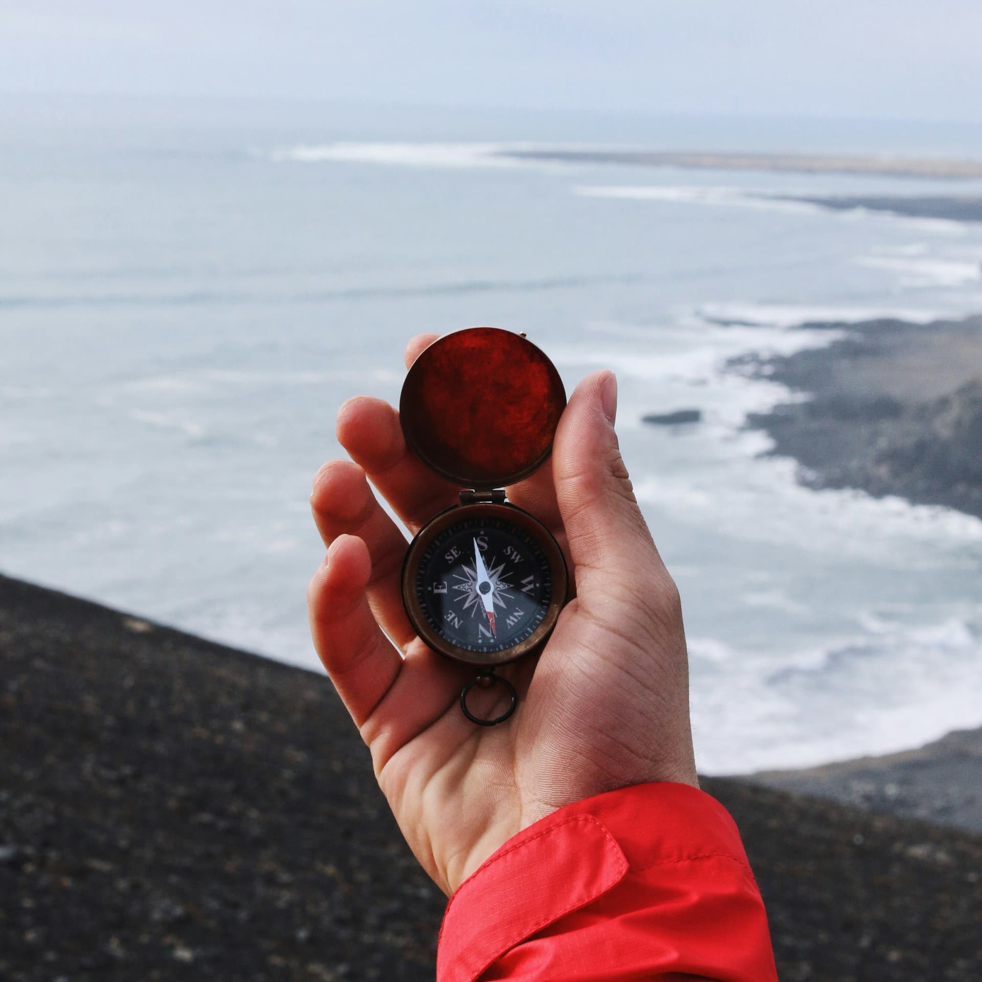 A compass pointing the way against a sea background, symbolizing navigating the choices of AI models